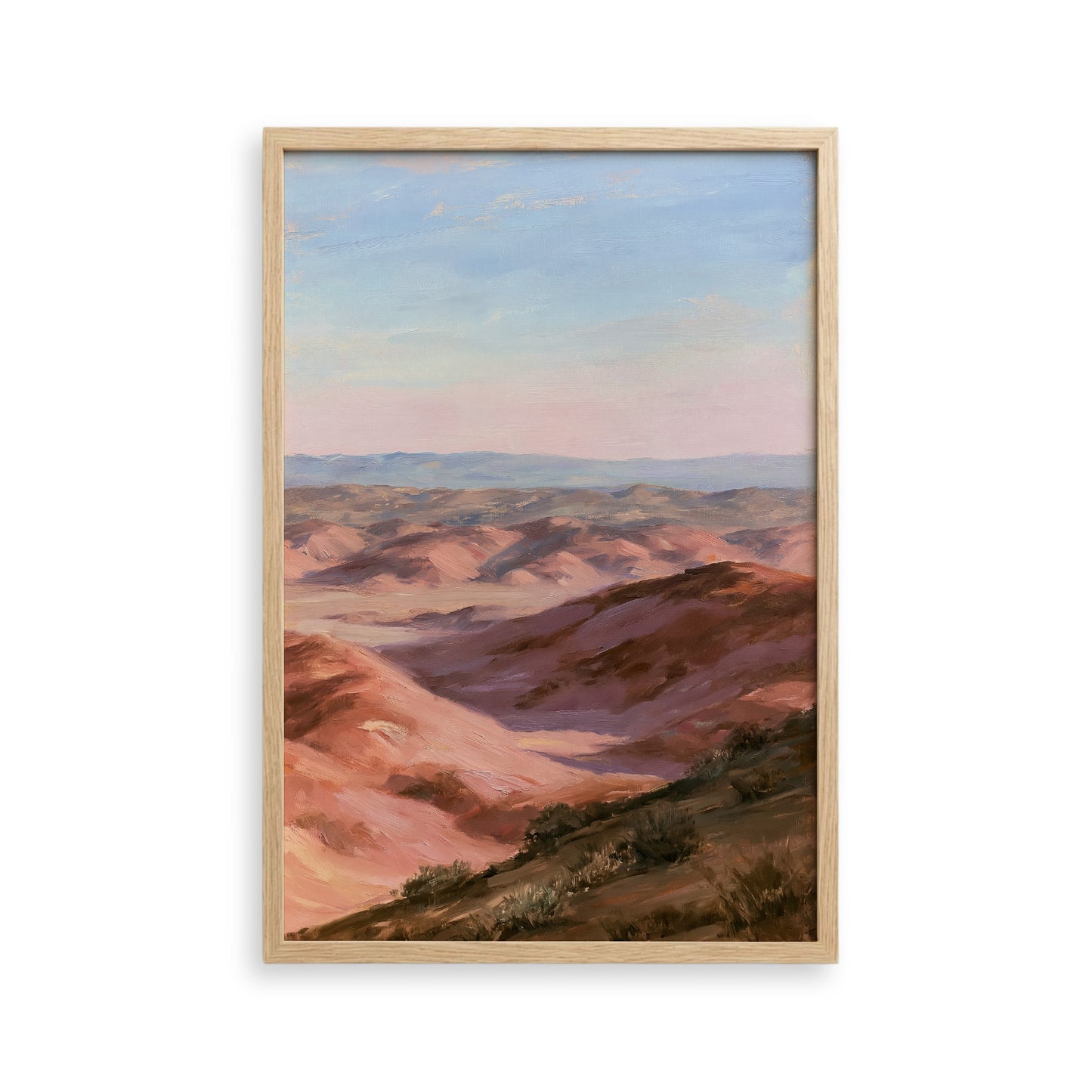 The image is a framed painting depicting a scenic landscape with rolling hills and a clear blue sky.