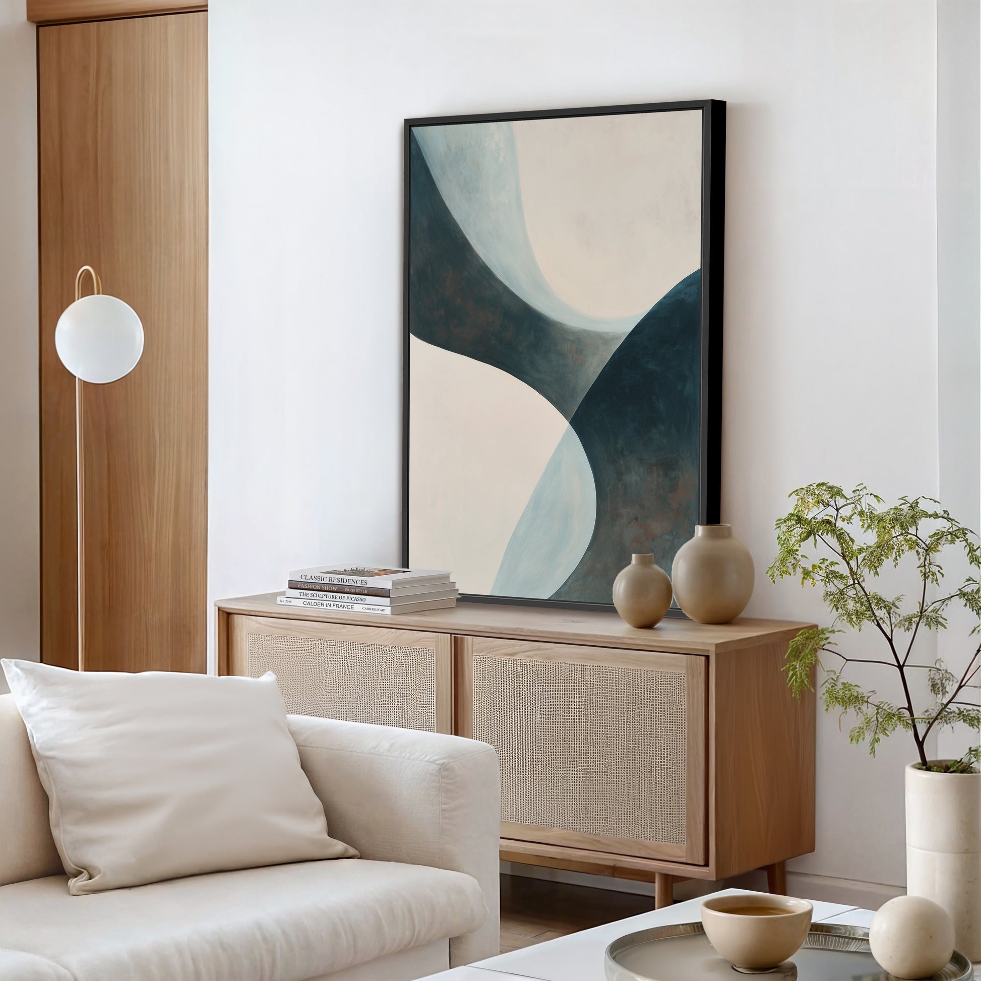 'Bend' canvas artwork featuring abstract soft curves in teal, cream, and muted earth tones in a modern living room setting