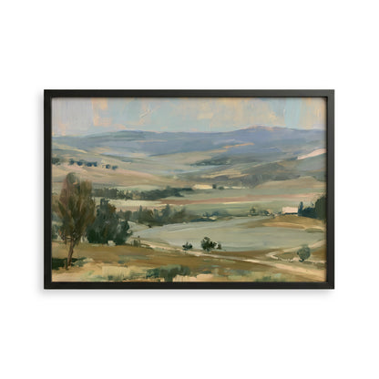 The image is a framed landscape painting depicting a serene countryside scene with rolling hills, trees, and a body of water in the distance.