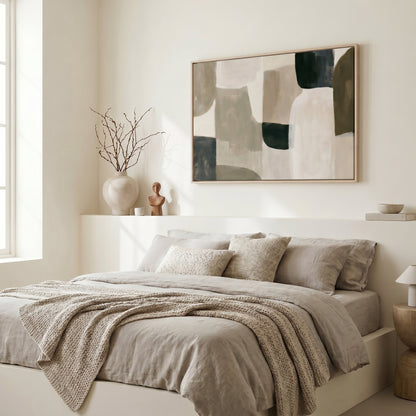 a serene and modern bedroom with a large bed, a minimalist white wall, and a large abstract painting above it.