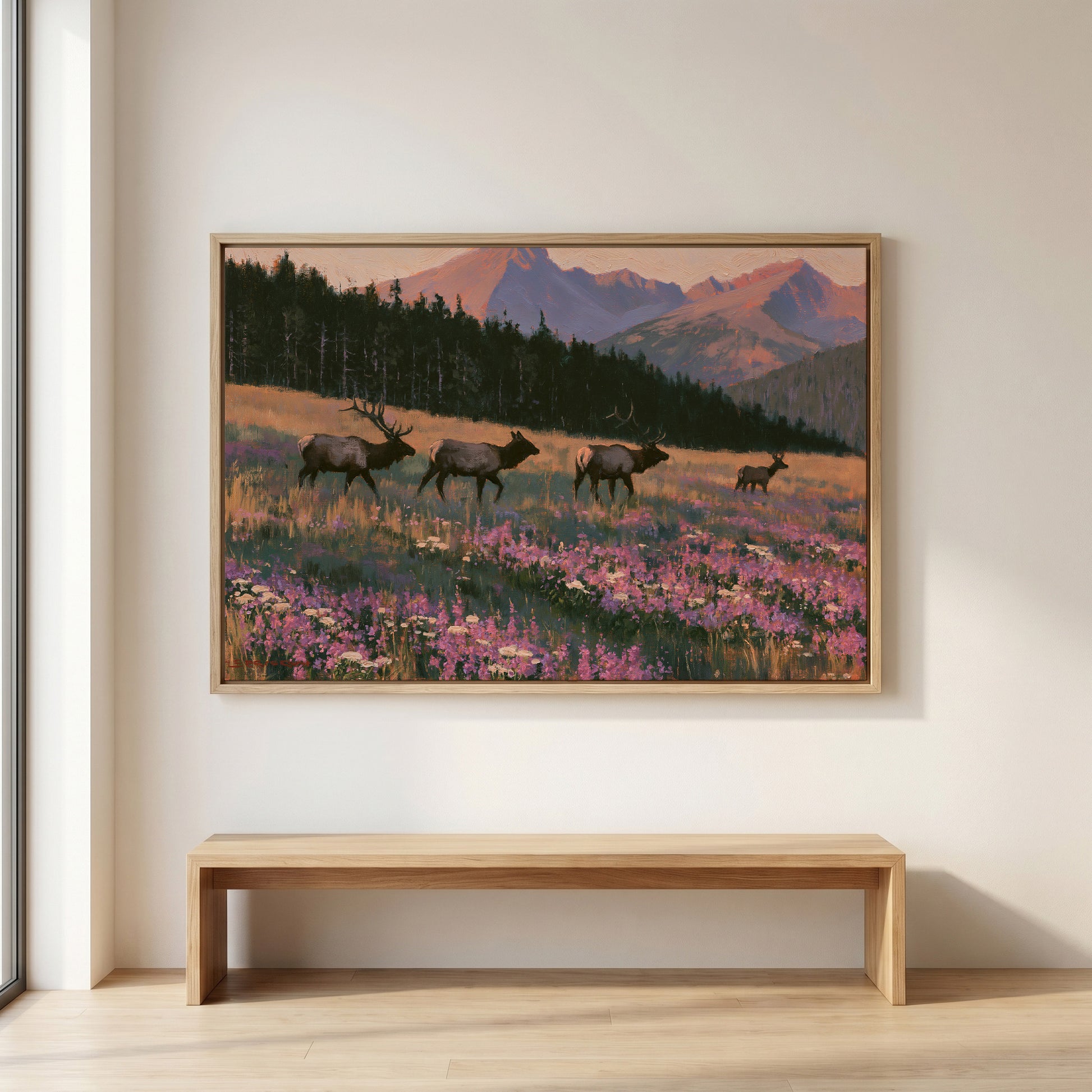 a large painting of three elk in a field with purple flowers, set against a backdrop of mountains.