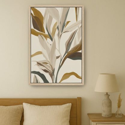 Lilt Canvas Print botanical artwork with earthy gold, taupe, and sage leaves in light wood frame above bed in minimalist bedroom