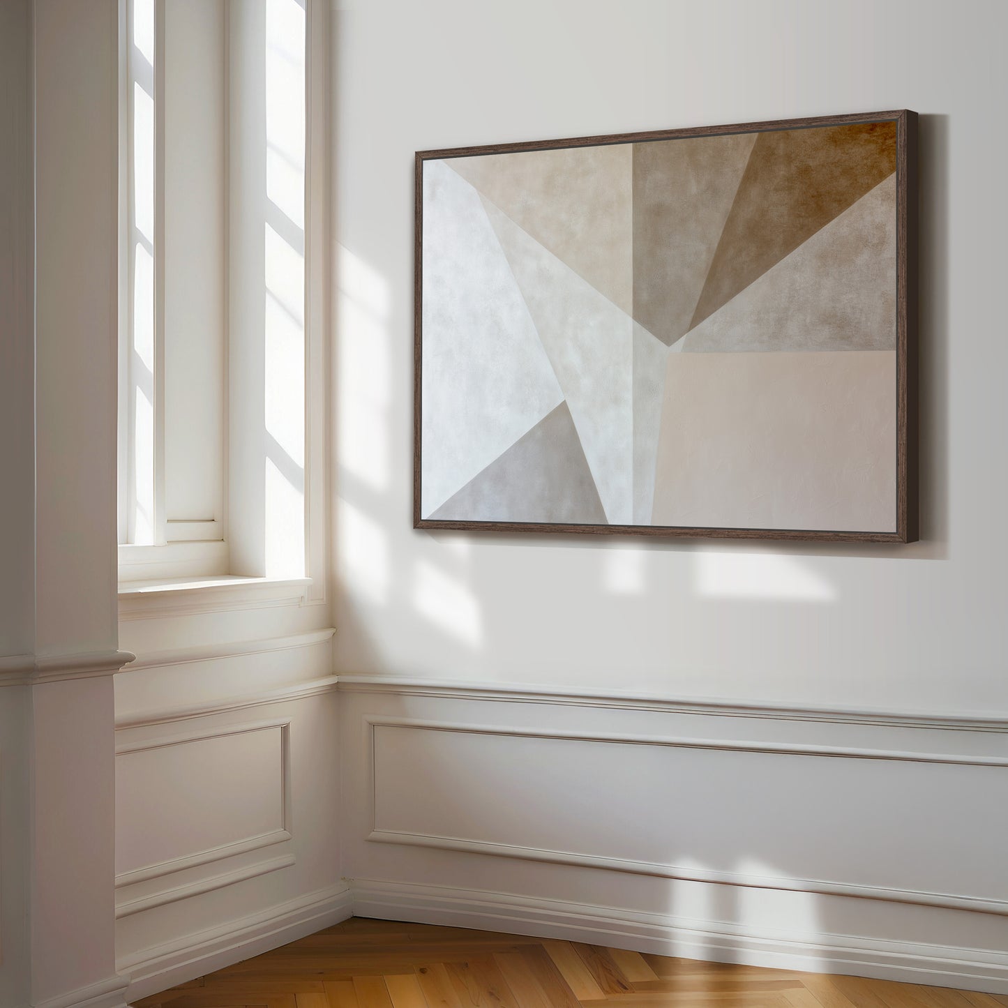 a large abstract painting hanging on a white wall in a room with a wooden floor.