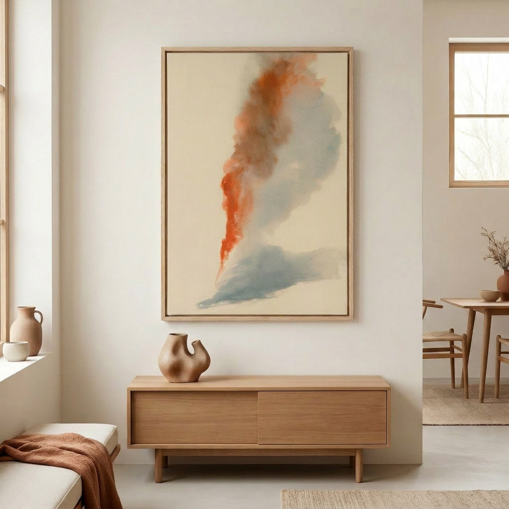 a minimalist living room with a large abstract painting hanging on the wall above a wooden cabinet. The painting has a mix of orange and blue colors, creating a vibrant and dynamic visual element in the space. The room also includes a dining table, chairs, and various decorative items such as vases and a potted plant, contributing to the overall aesthetic and design of the space.