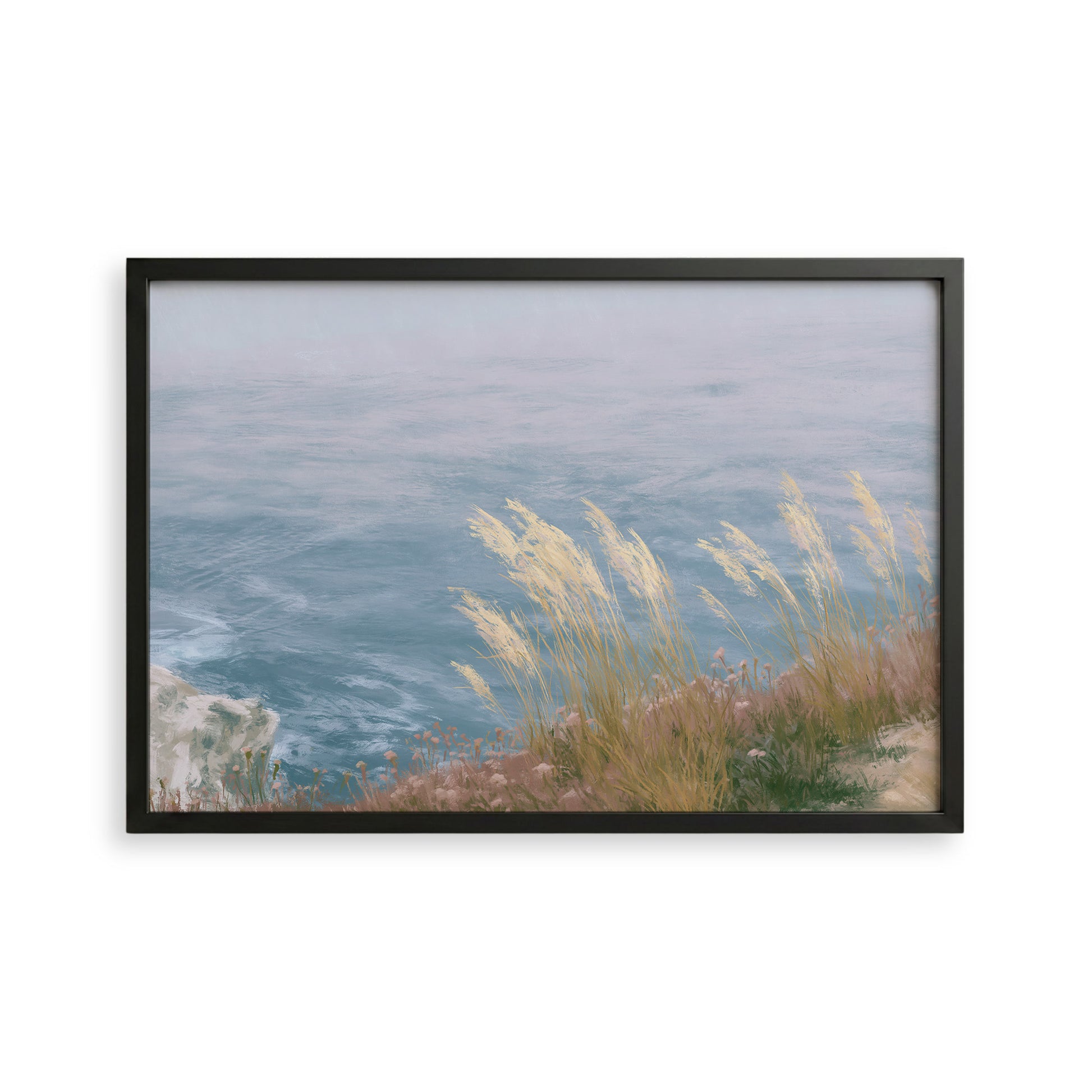 A framed image depicting a serene coastal landscape with a rocky cliff overlooking a vast body of water.