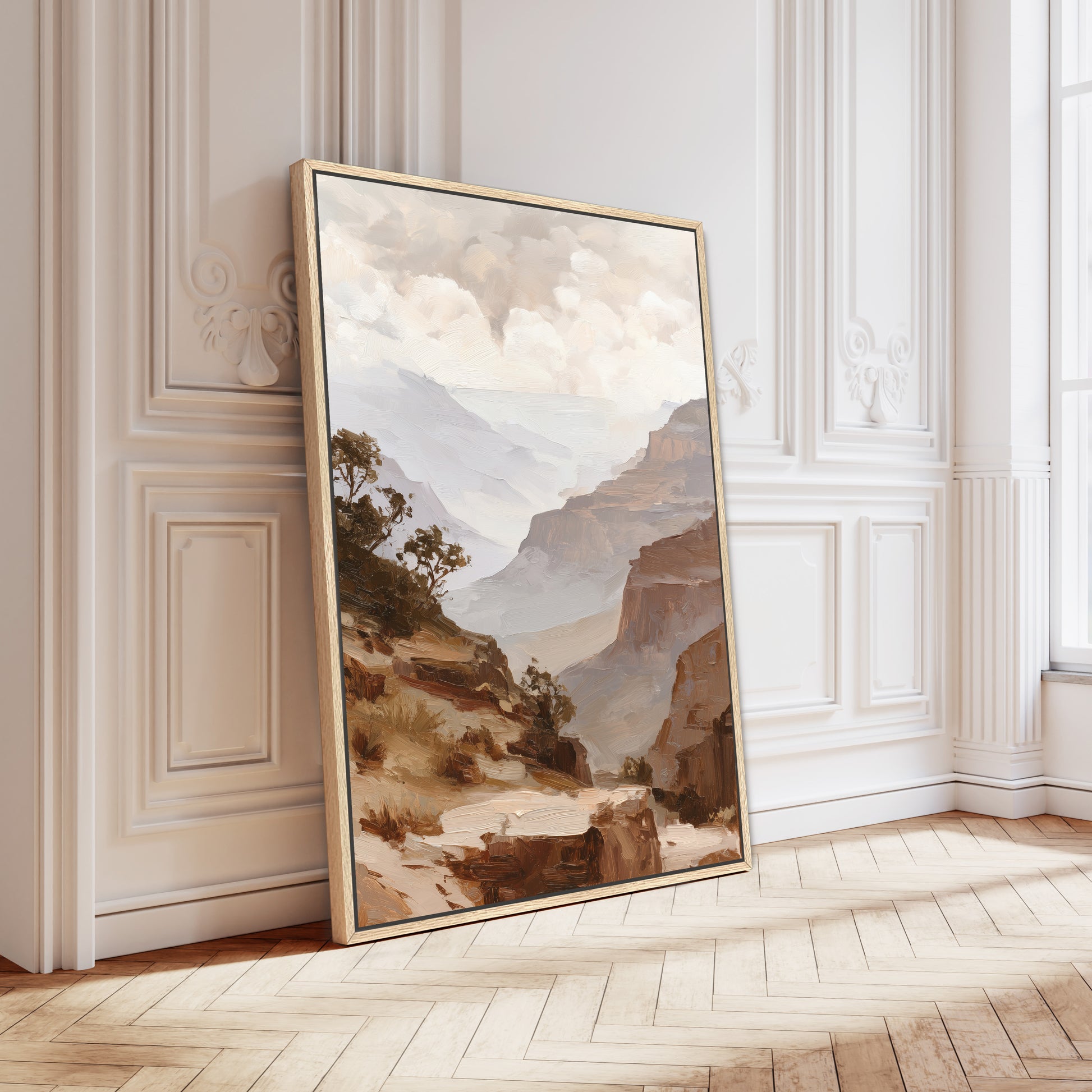 a large landscape painting hanging on a white wall in a room with a wooden floor.