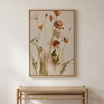 a large framed painting of flowers hanging on a wall above a wooden bench.