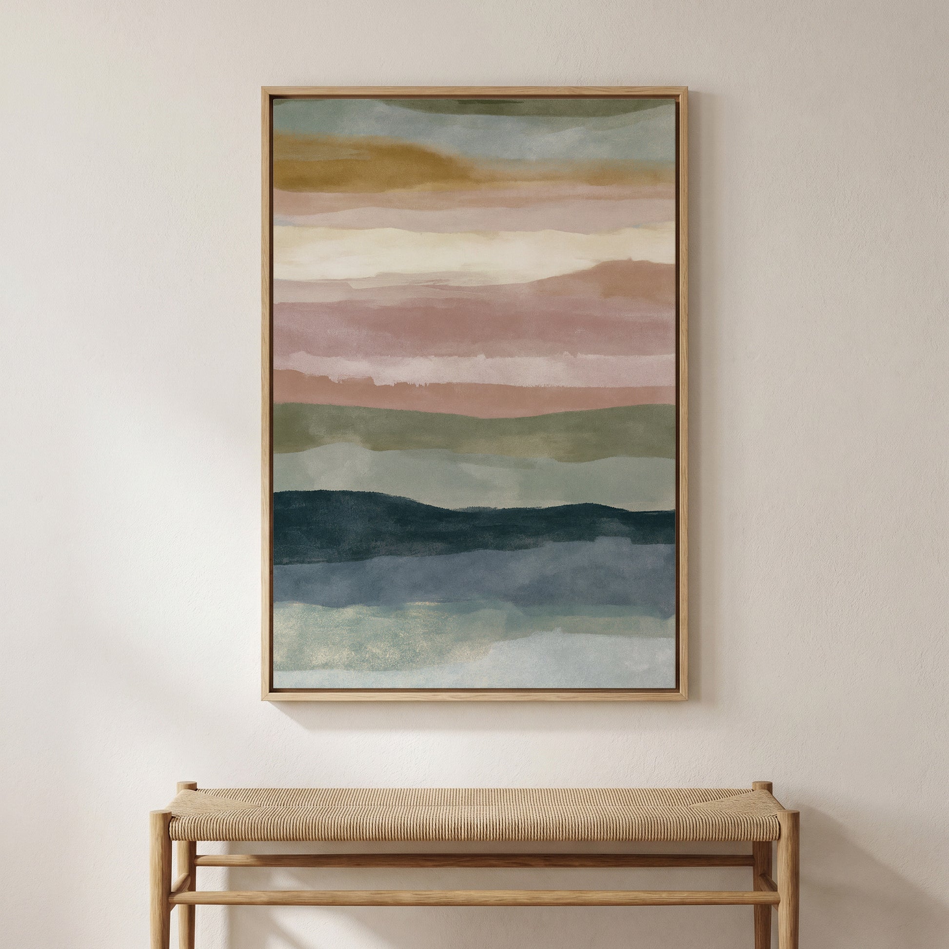 a large abstract painting hanging on a wall above a wooden bench.