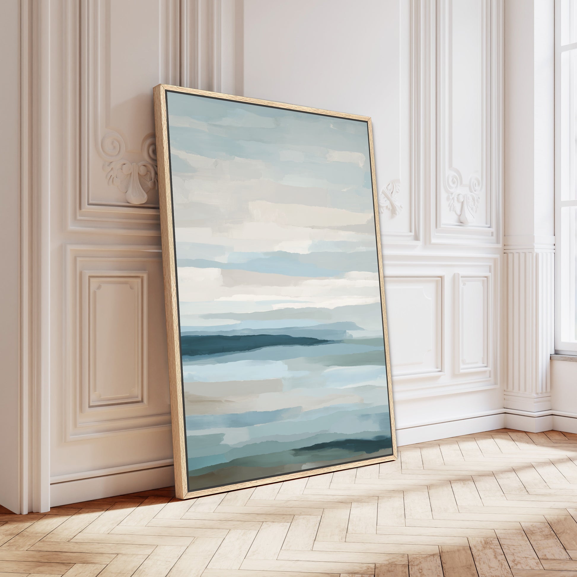 Lapse canvas print depicting serene sea and sky with soft blue, ivory, and sand tones in a natural wood frame.