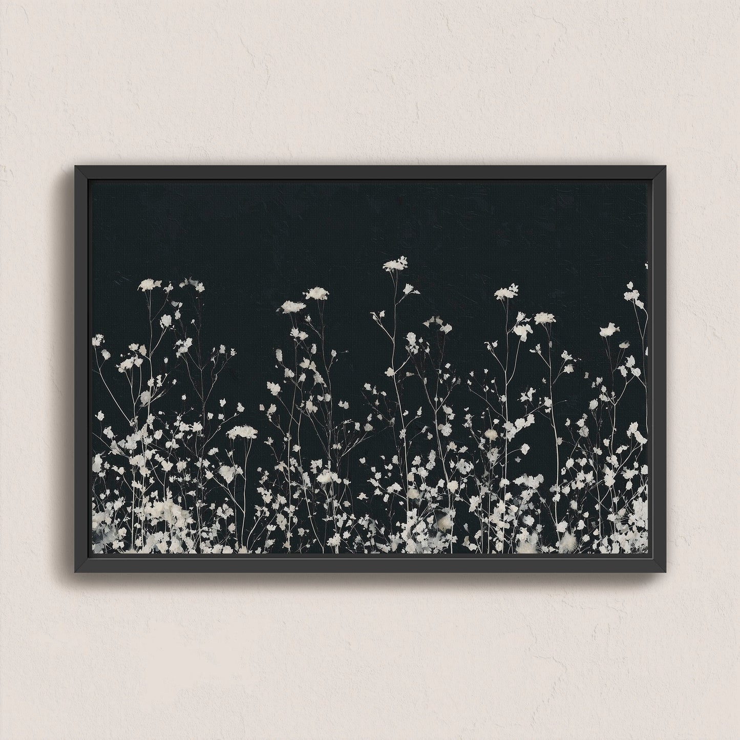 Noiré Canvas Wall Art featuring delicate white florals on a deep charcoal background in a black frame