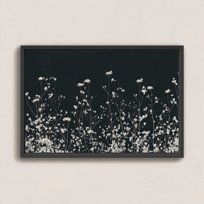 Noiré Canvas Wall Art featuring delicate white florals on a deep charcoal background in a black frame