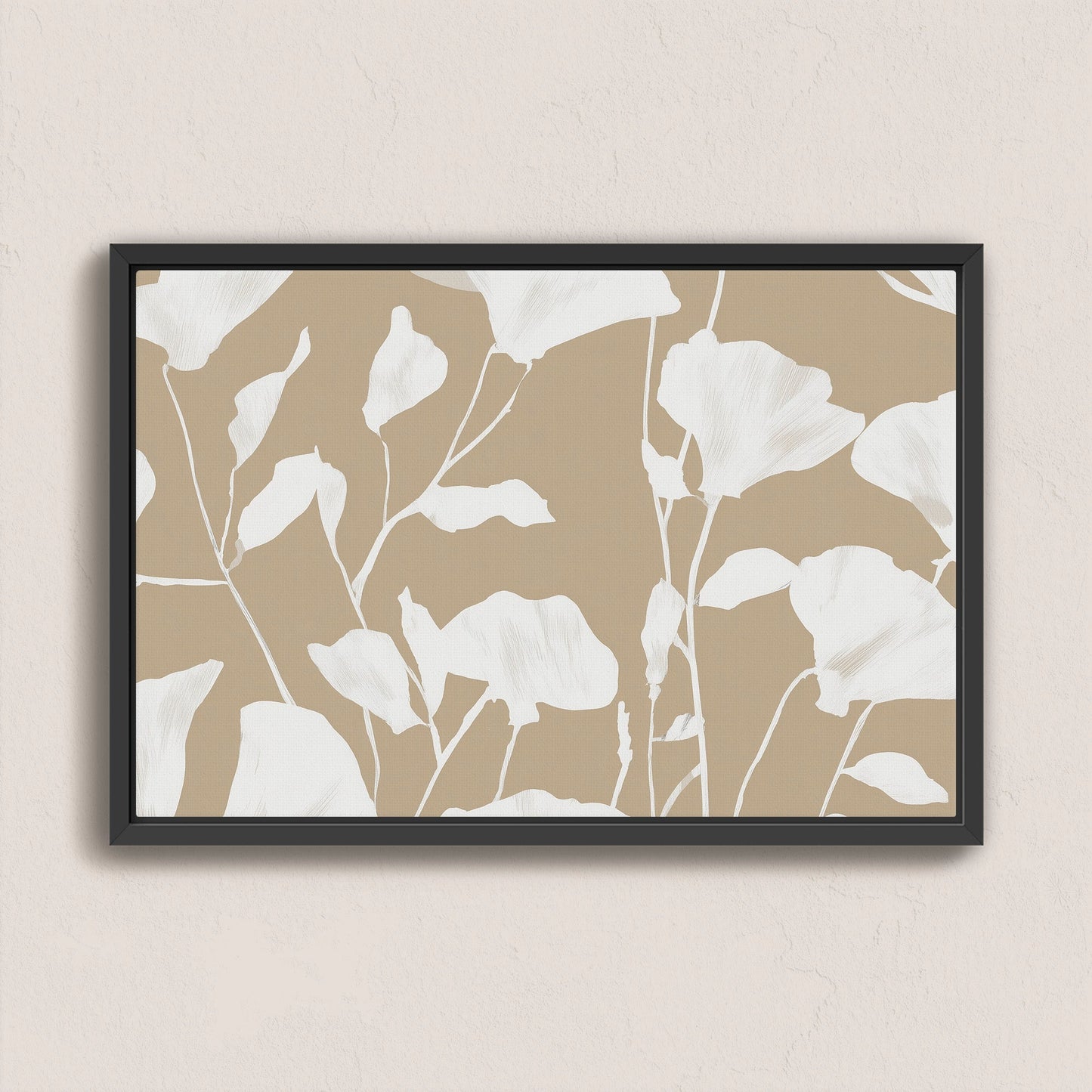 Driftleaf canvas print with white floral silhouettes on beige background in black frame