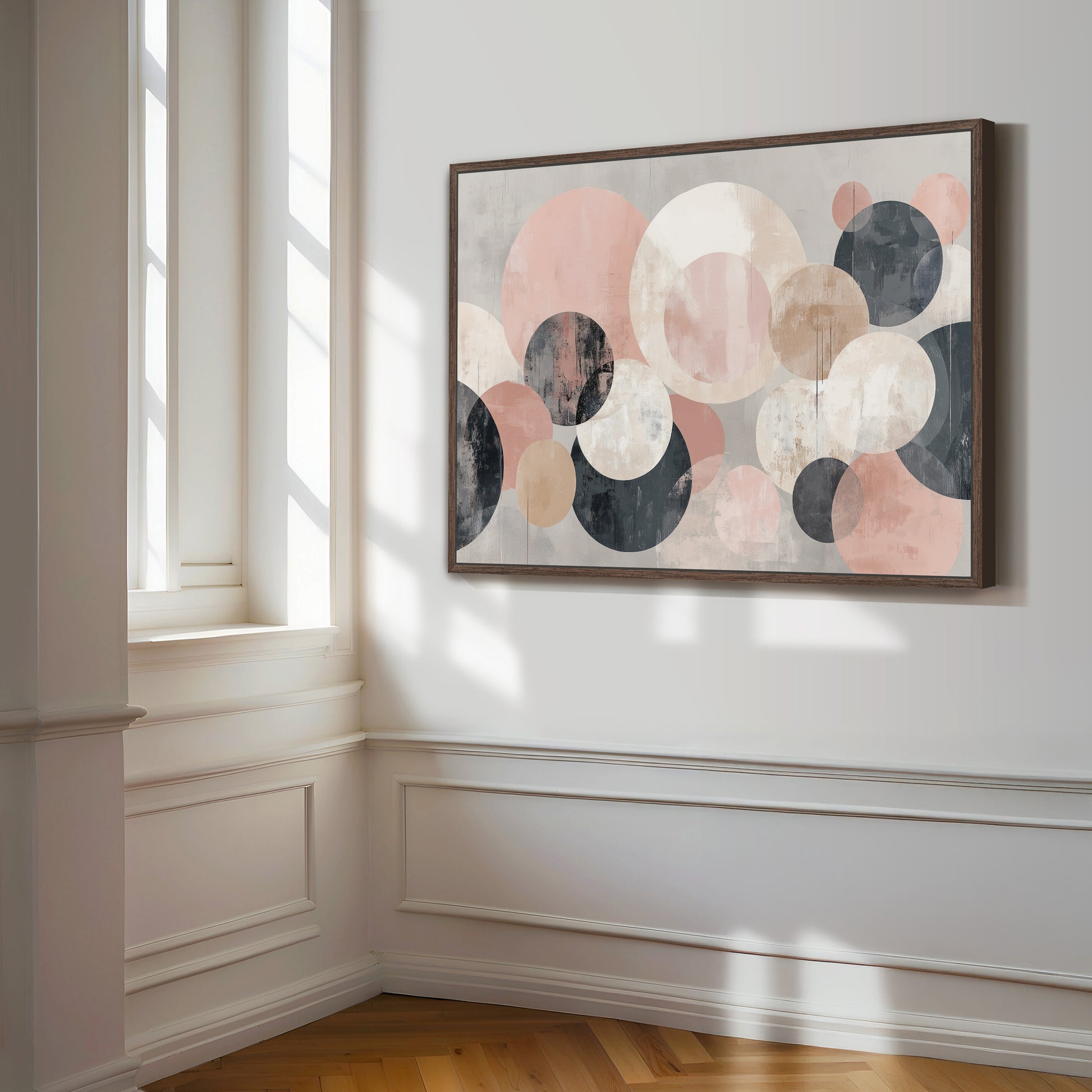 a large abstract painting hanging on a white wall in a room with a wooden floor.