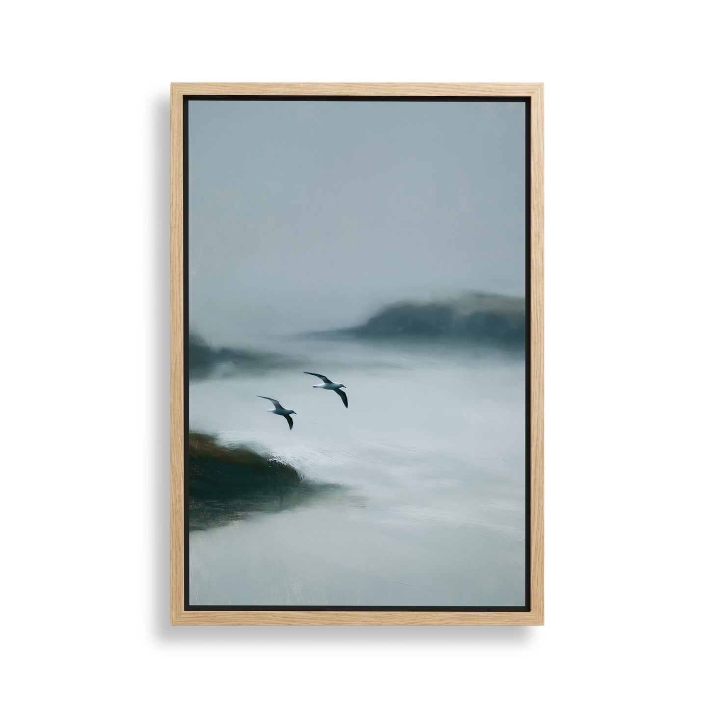 two birds flying over a body of water, with a hazy, misty background.
