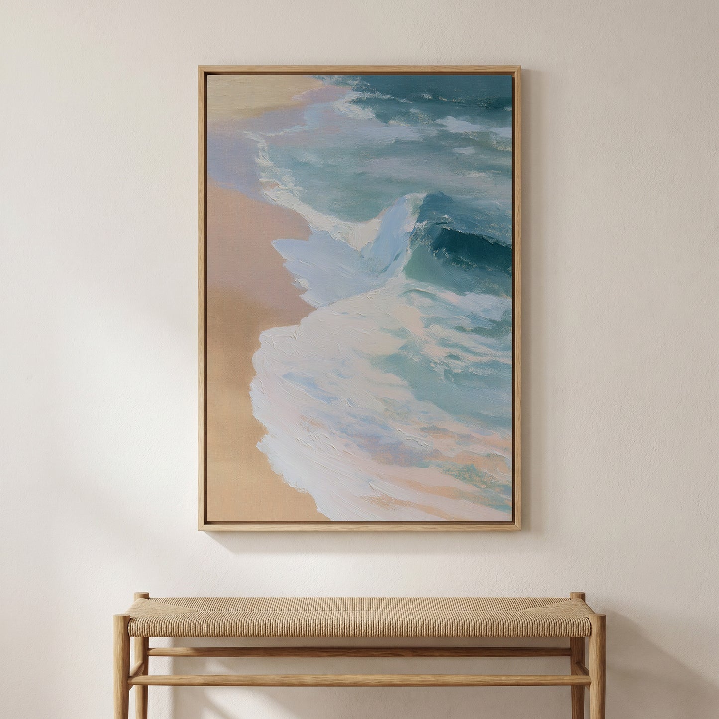 a large, framed painting of a beach scene hanging on a wall above a wooden bench.