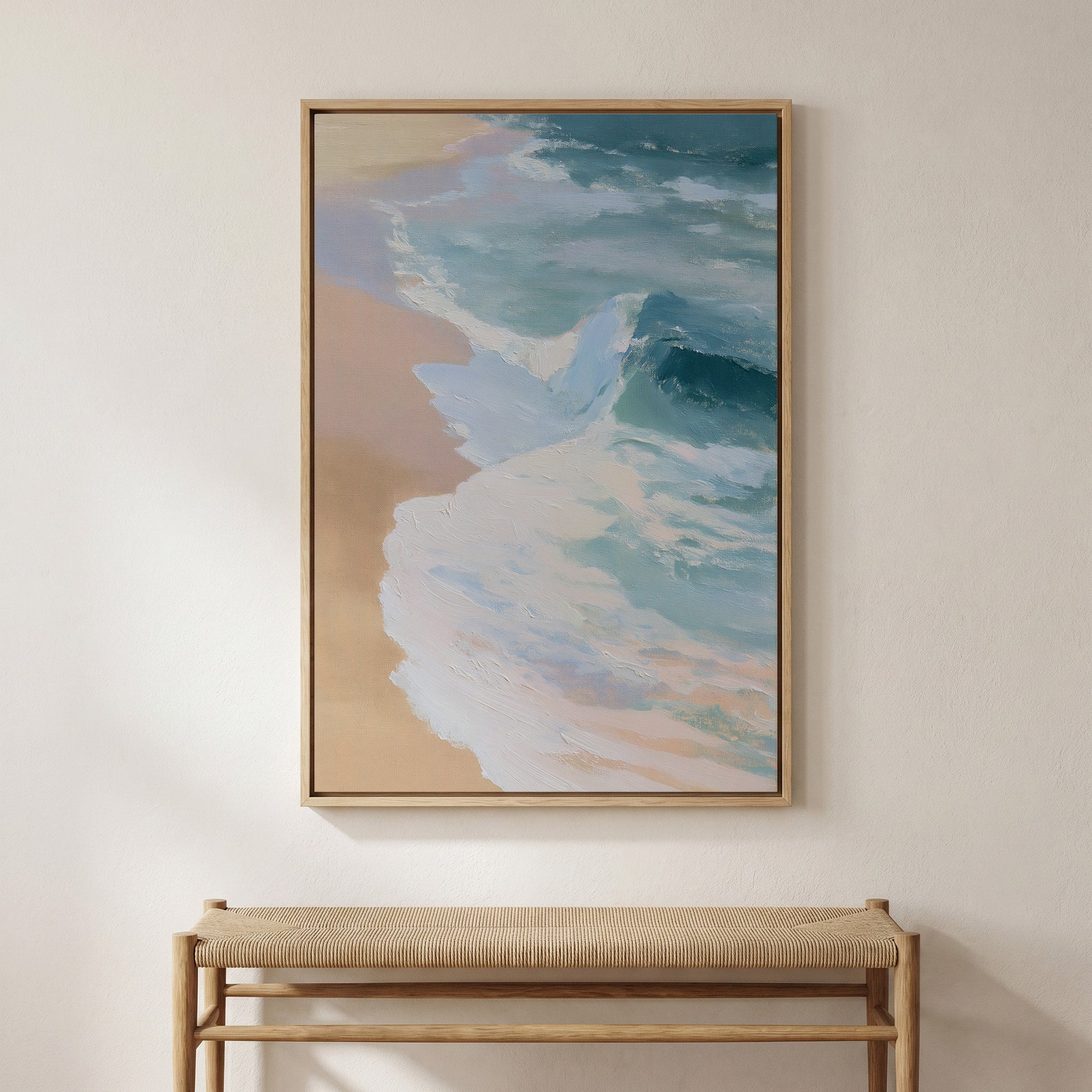 a large, framed painting of a beach scene hanging on a wall above a wooden bench.