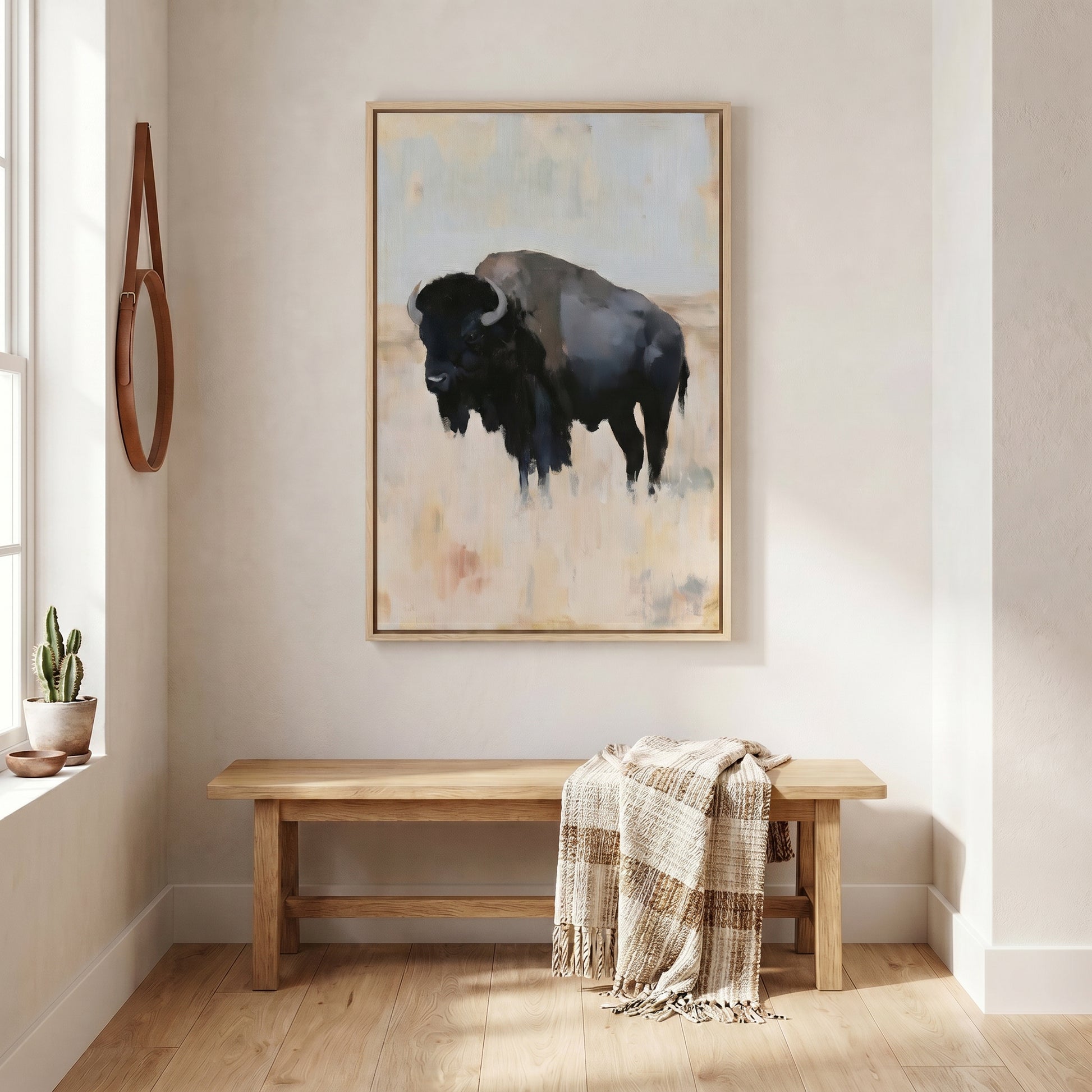 a large painting of a bison on the wall of a room with a wooden bench and a potted plant.