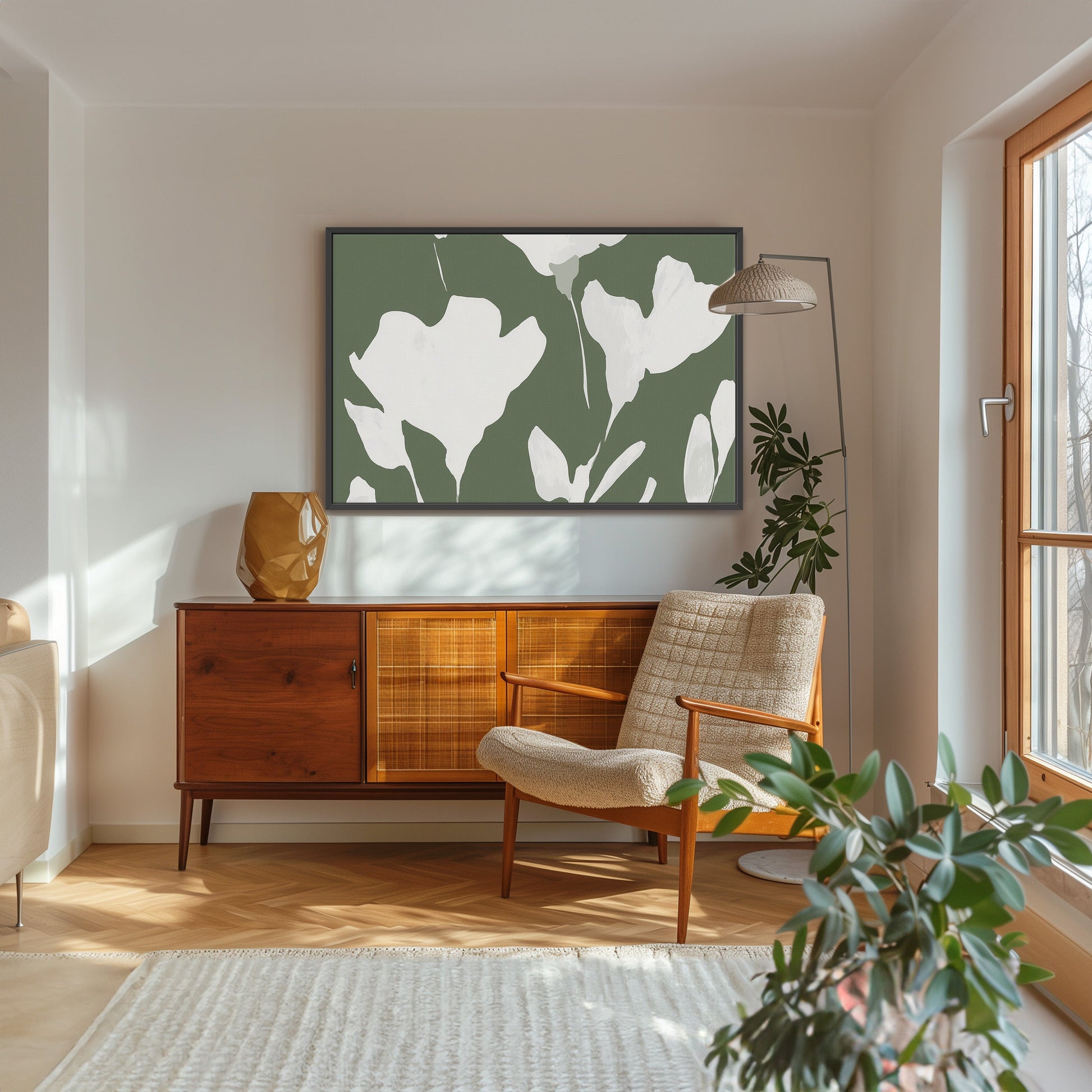 Verdal canvas print with ivory floral silhouettes on muted olive background in modern living room setting