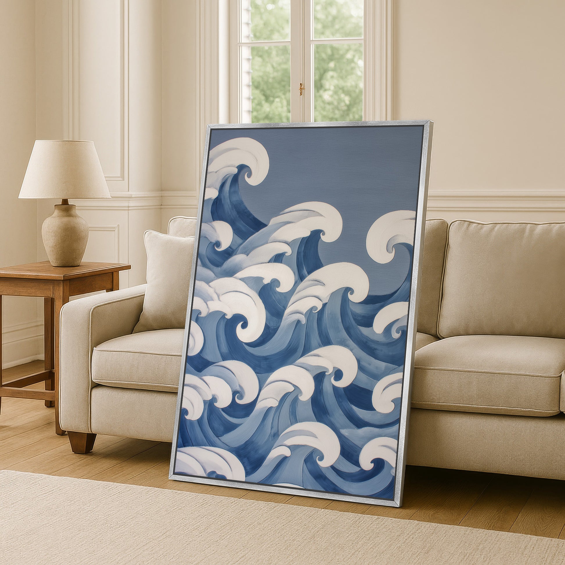 a large framed artwork depicting a blue wave design on a wall in a living room setting.