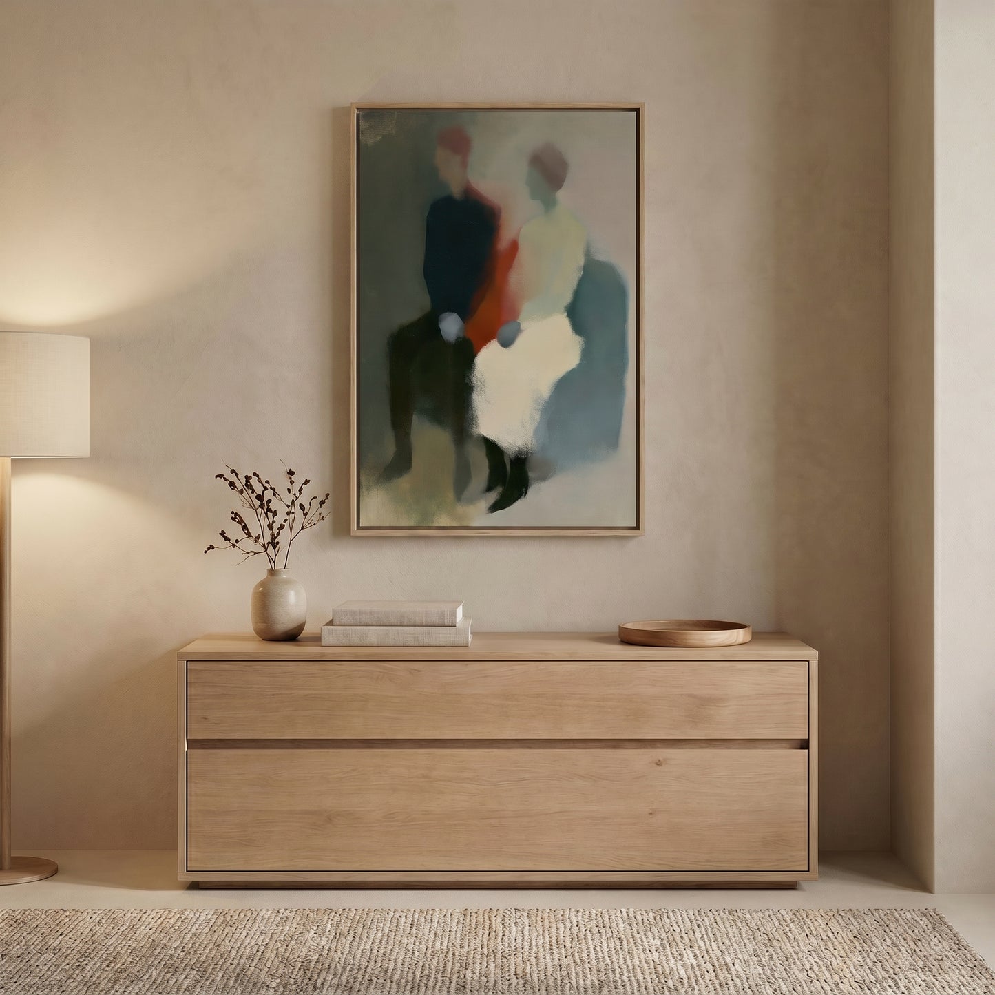 a minimalist interior design with a wooden dresser, a framed abstract painting, and a vase of branches on the dresser.