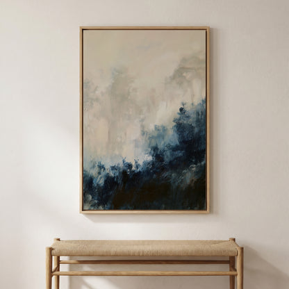 a large abstract painting hanging on a white wall above a wooden bench.