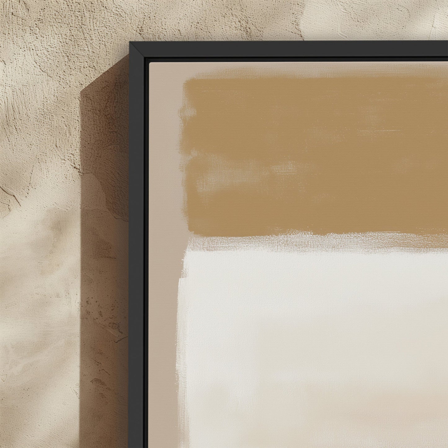 Sienna Canvas Print abstract warm golden and ivory tones in black frame on textured wall