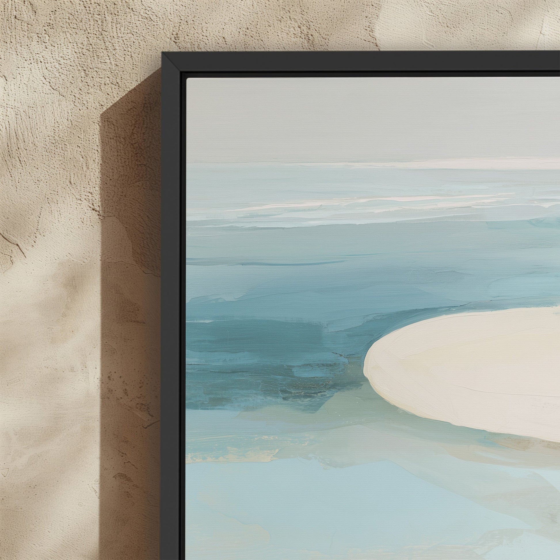 Tideway Canvas Wall Art depicting calm sea and sand in soft blues and ivory with minimalist coastal horizon in black frame
