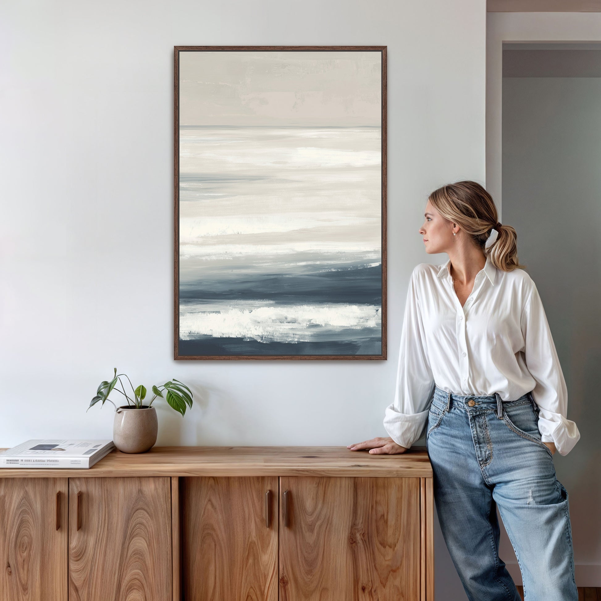 Syd Canvas Print minimalist seascape in ivory, sand, and indigo tones, framed and hanging above wood cabinet in modern interior