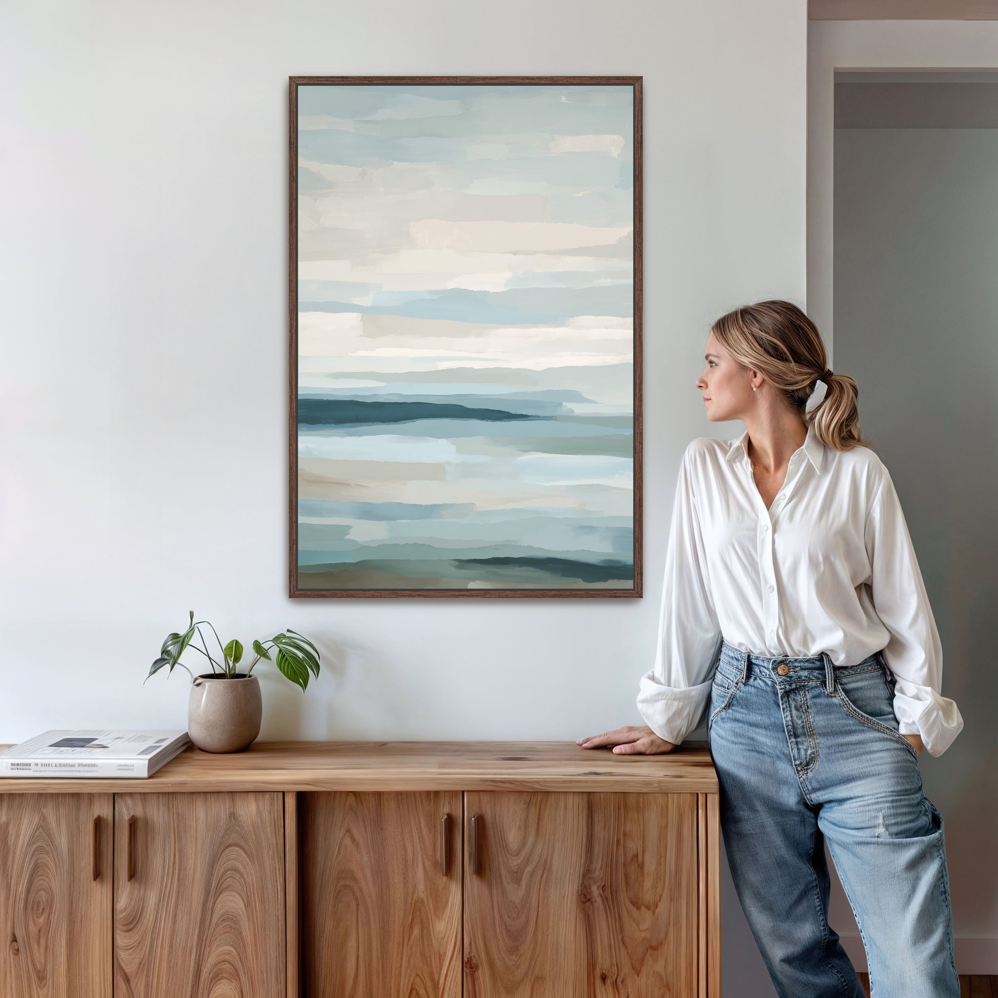 Lapse Canvas Print abstract sea and sky art in soft blue and ivory tones hanging in modern room