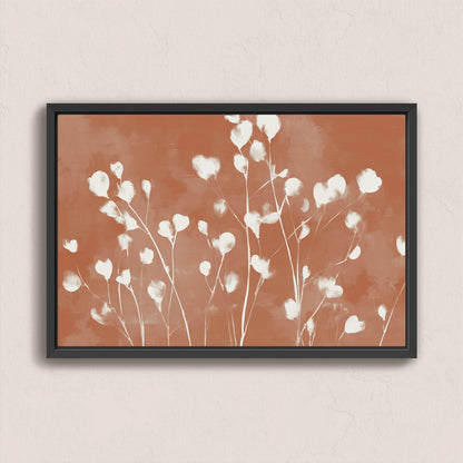 Ember canvas print with white floral design on terracotta background in black frame