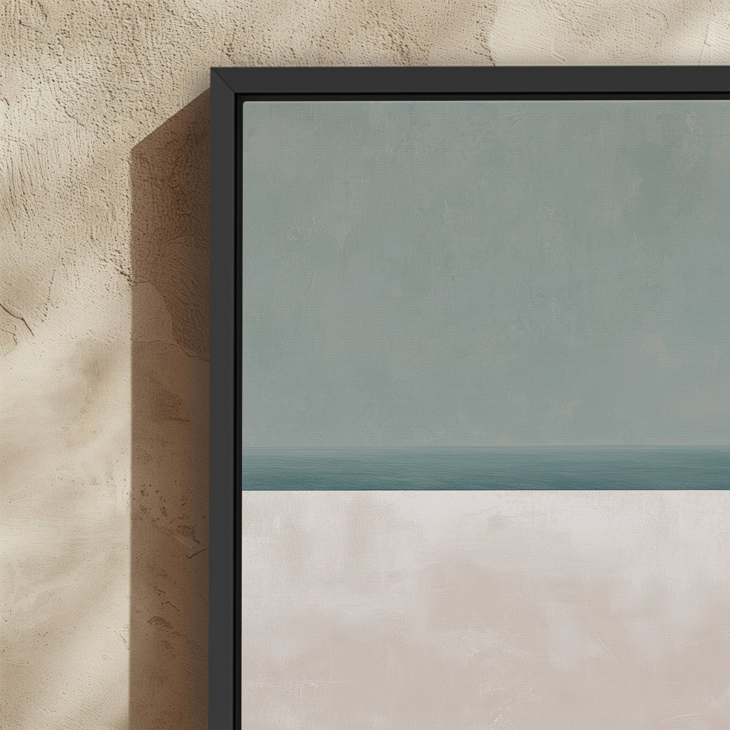 Minimalist Azure canvas print with muted sage and sand hues in a black frame on textured wall