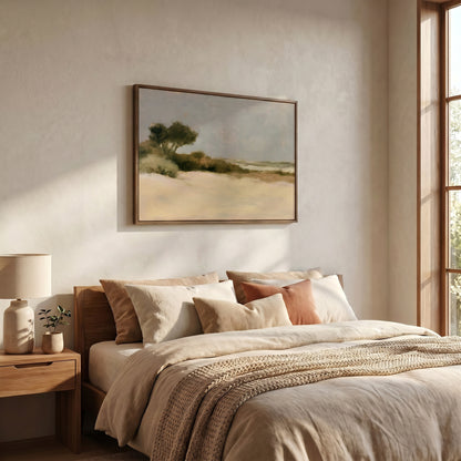 a serene bedroom scene with a large bed adorned with beige bedding and a wooden headboard. Above the bed, a framed landscape painting hangs on the wall, adding an artistic touch to the room. The room is well-lit, with natural light streaming in from a window on the right side, creating a warm and inviting atmosphere.