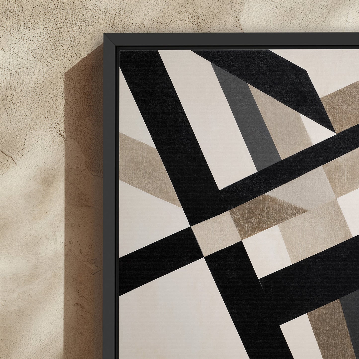 Axis Canvas Print featuring bold black and neutral geometric lines in a modern black frame on textured wall