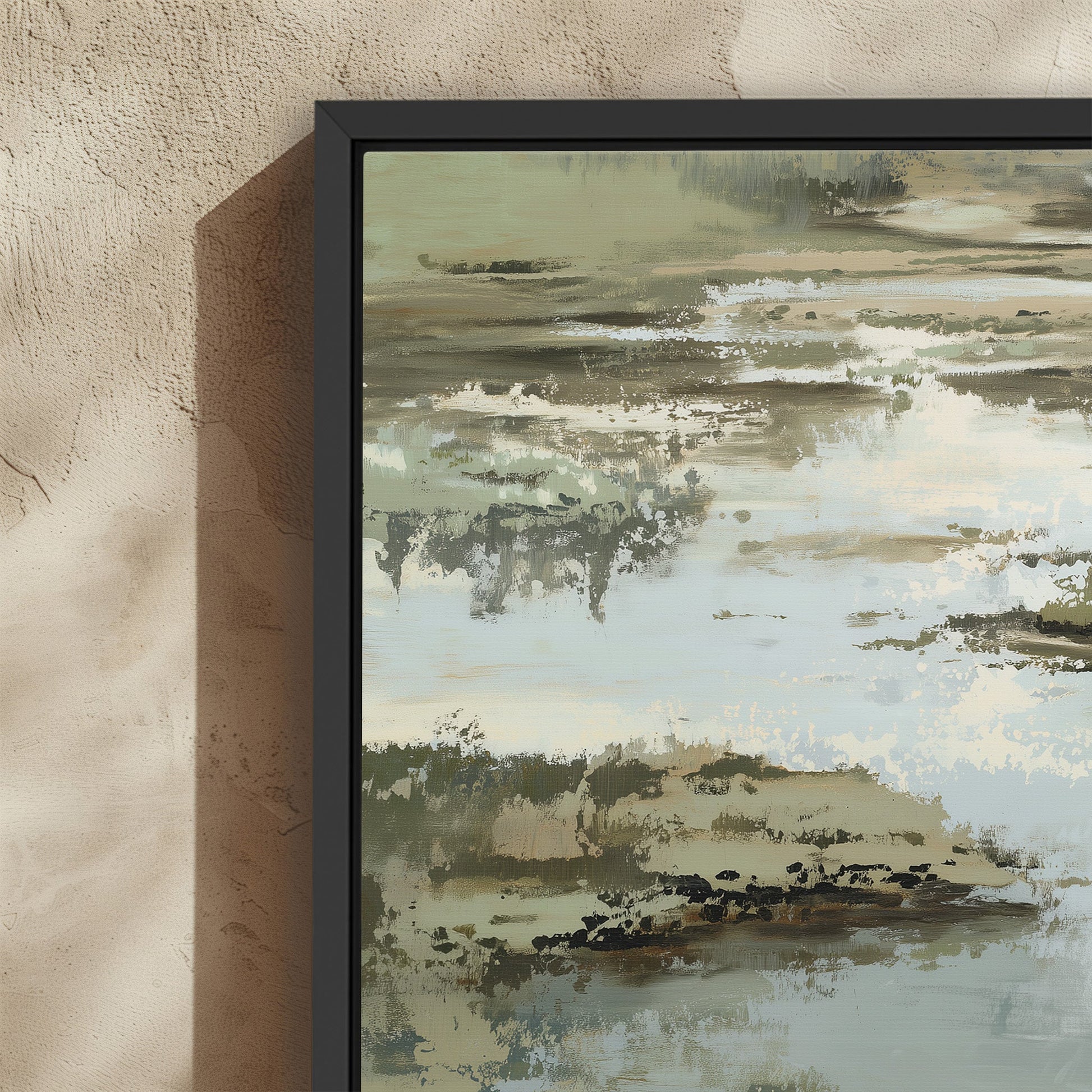 Reed Canvas Print abstract landscape in sage, sand, and ivory tones with black frame on textured wall