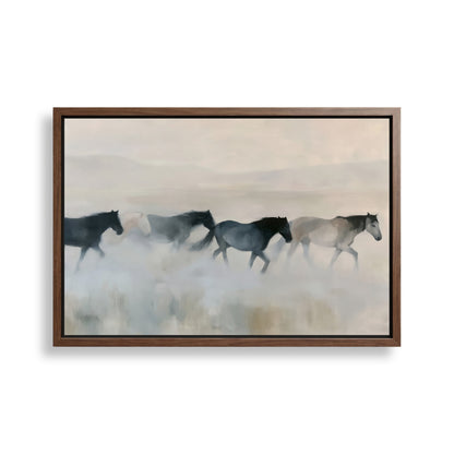 A group of horses running across a field, with a hazy, misty background.