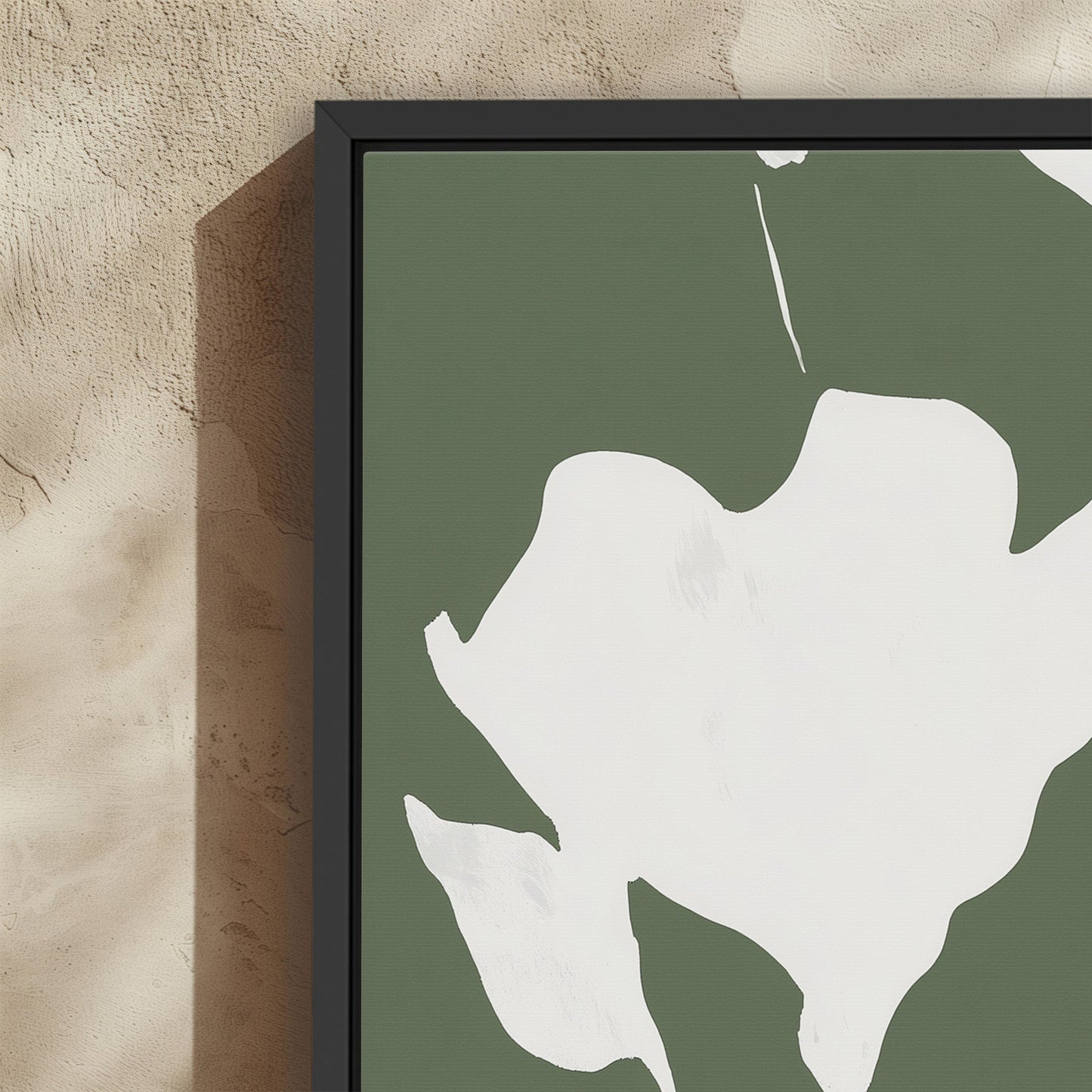 Verdal Canvas Print with ivory floral silhouettes on muted olive background in black frame