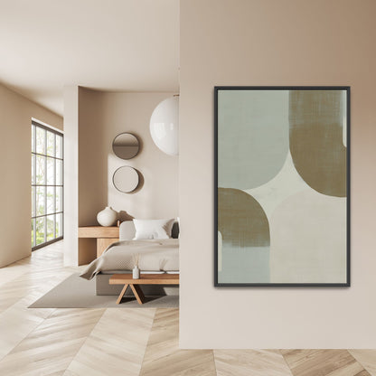 Abstract geometric Forma canvas art with muted sage, ivory, and taupe tones in a black frame on a beige wall in a minimalist bedroom