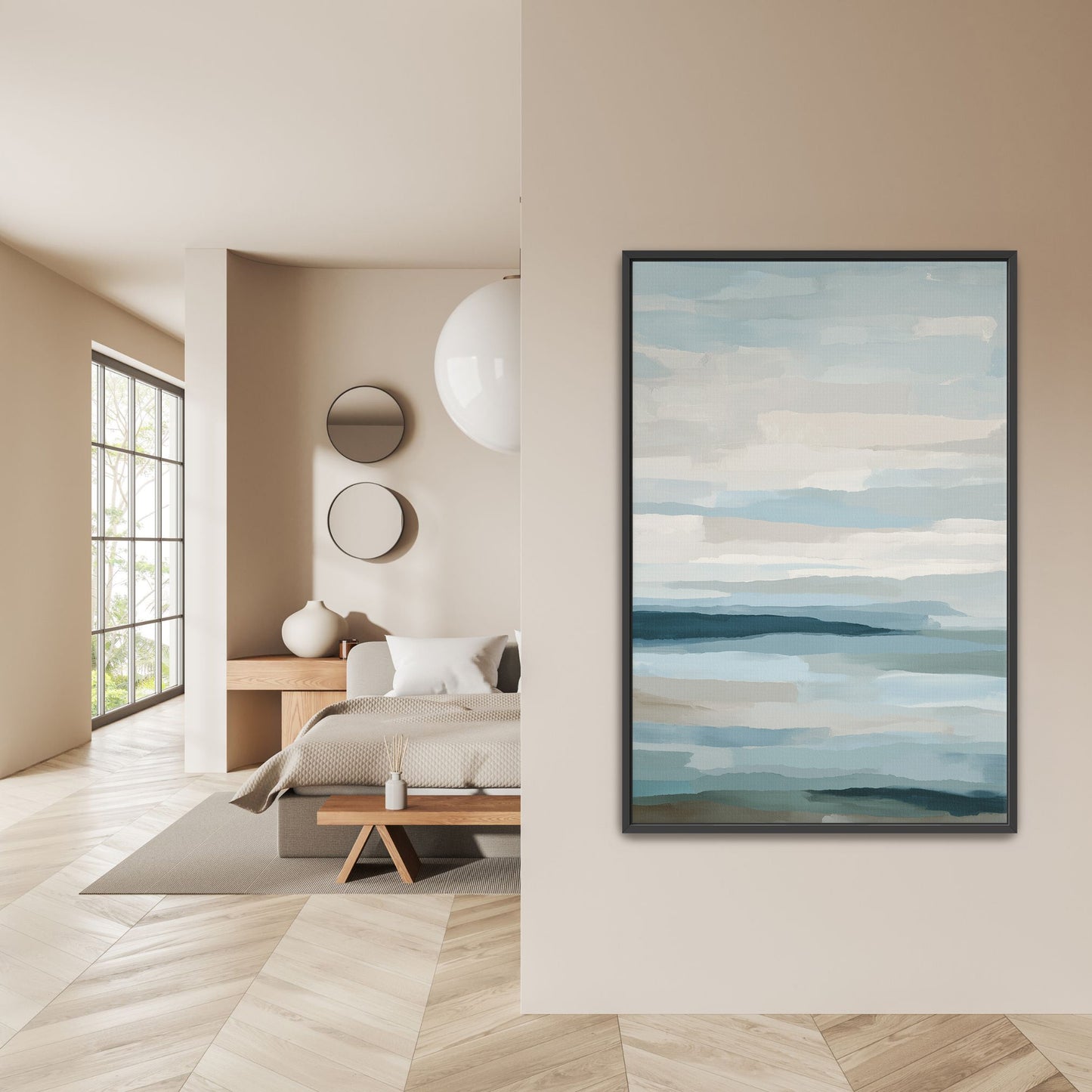 Lapse canvas print with soft blue, ivory, and sand tones depicting sea and sky, framed in black, displayed in modern bedroom.