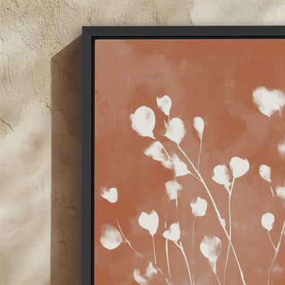 Ember Cavas Print with white petals on terracotta background in black frame