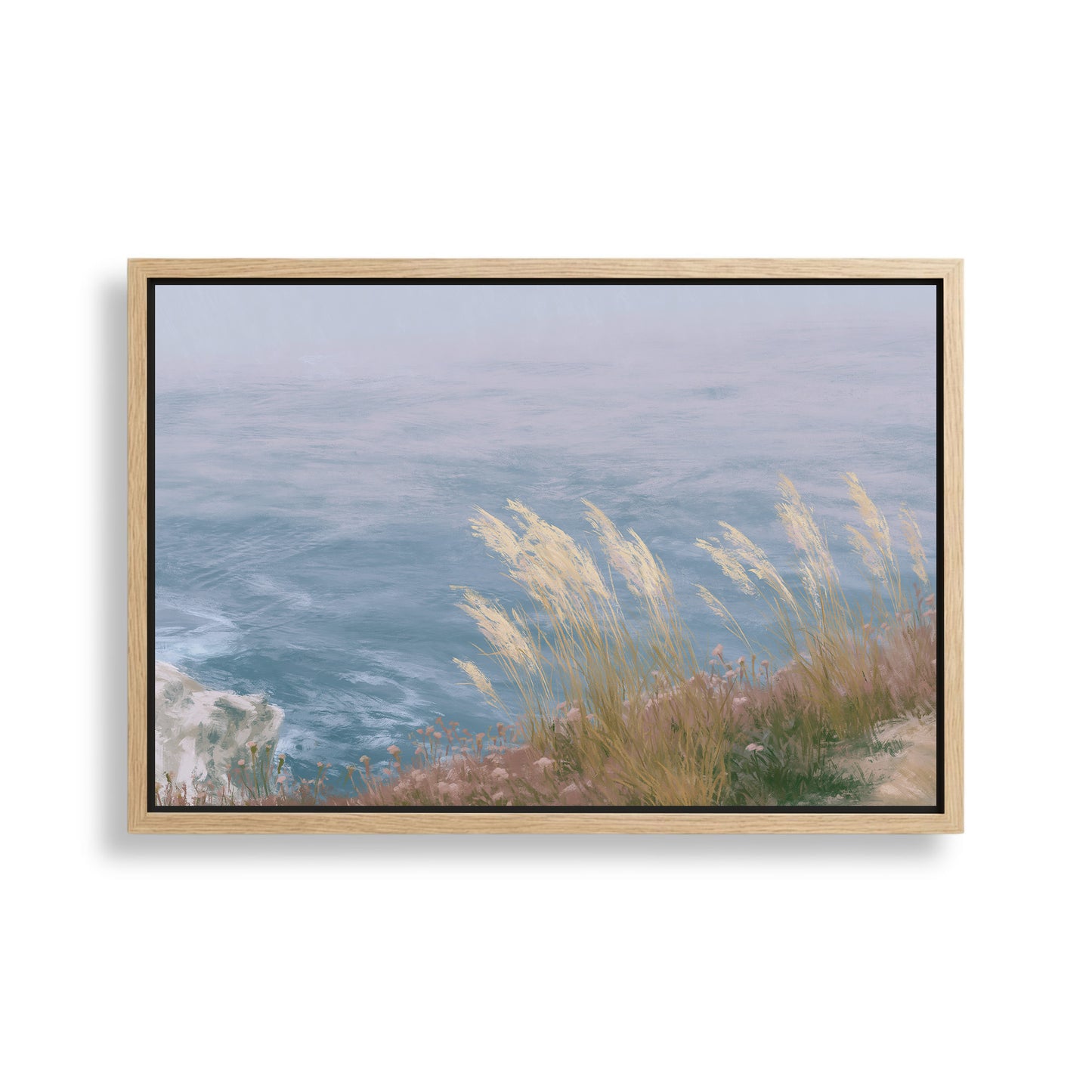 A framed painting depicting a serene coastal landscape with a rocky cliff overlooking the ocean.