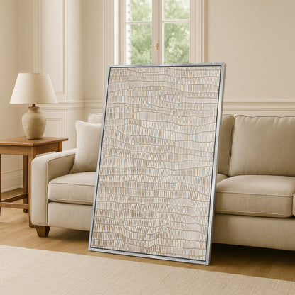 a large, rectangular, beige-colored artwork or painting displayed on a wall in a living room setting.