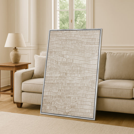 a large, rectangular, beige-colored artwork or painting displayed on a wall in a living room setting.