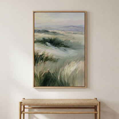 a large painting of a field with tall grass hanging on a wall above a wooden bench.