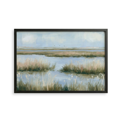 The image is a framed painting depicting a serene landscape with a body of water surrounded by tall grasses and a cloudy sky.