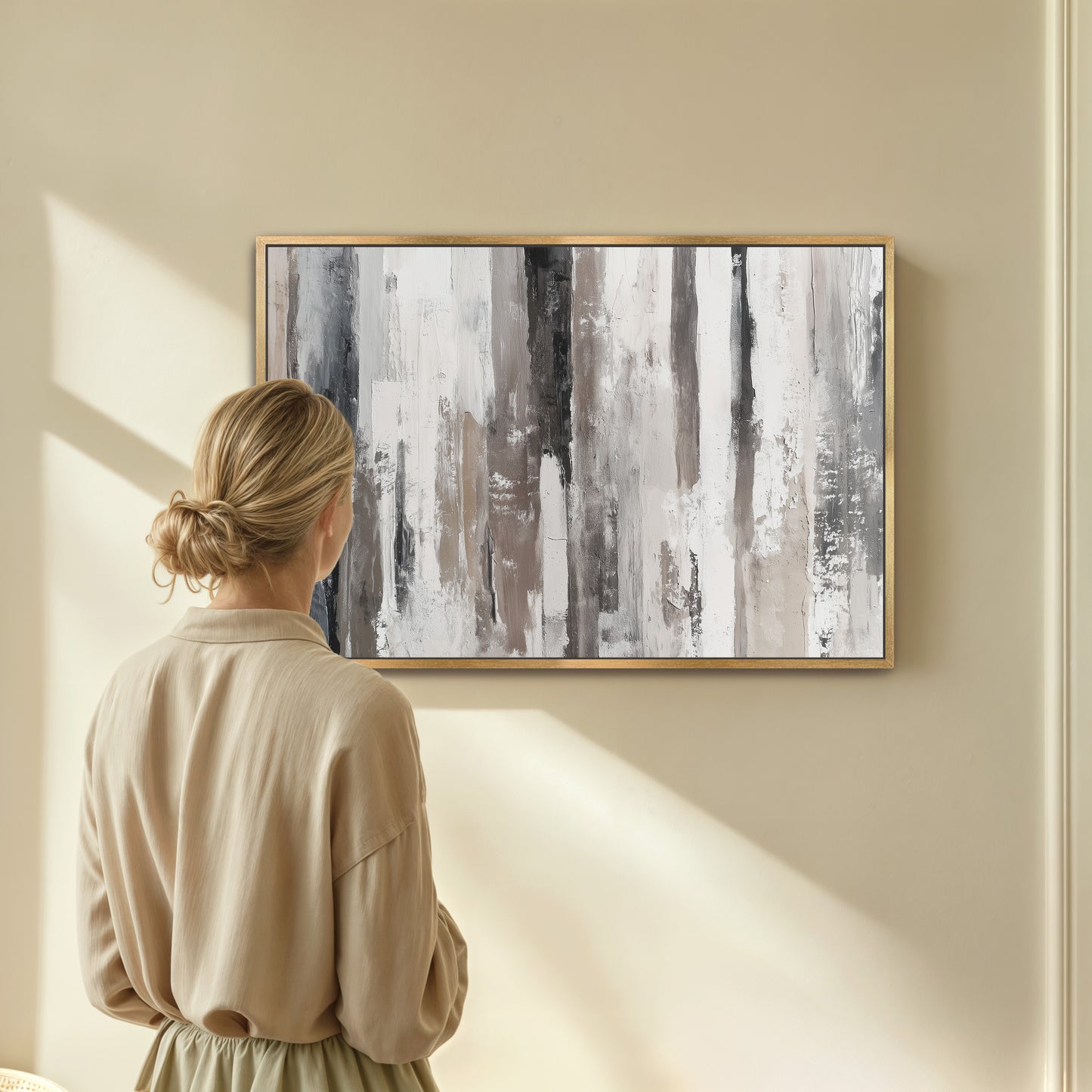 A woman stands in front of a large abstract painting, gazing at it with interest.