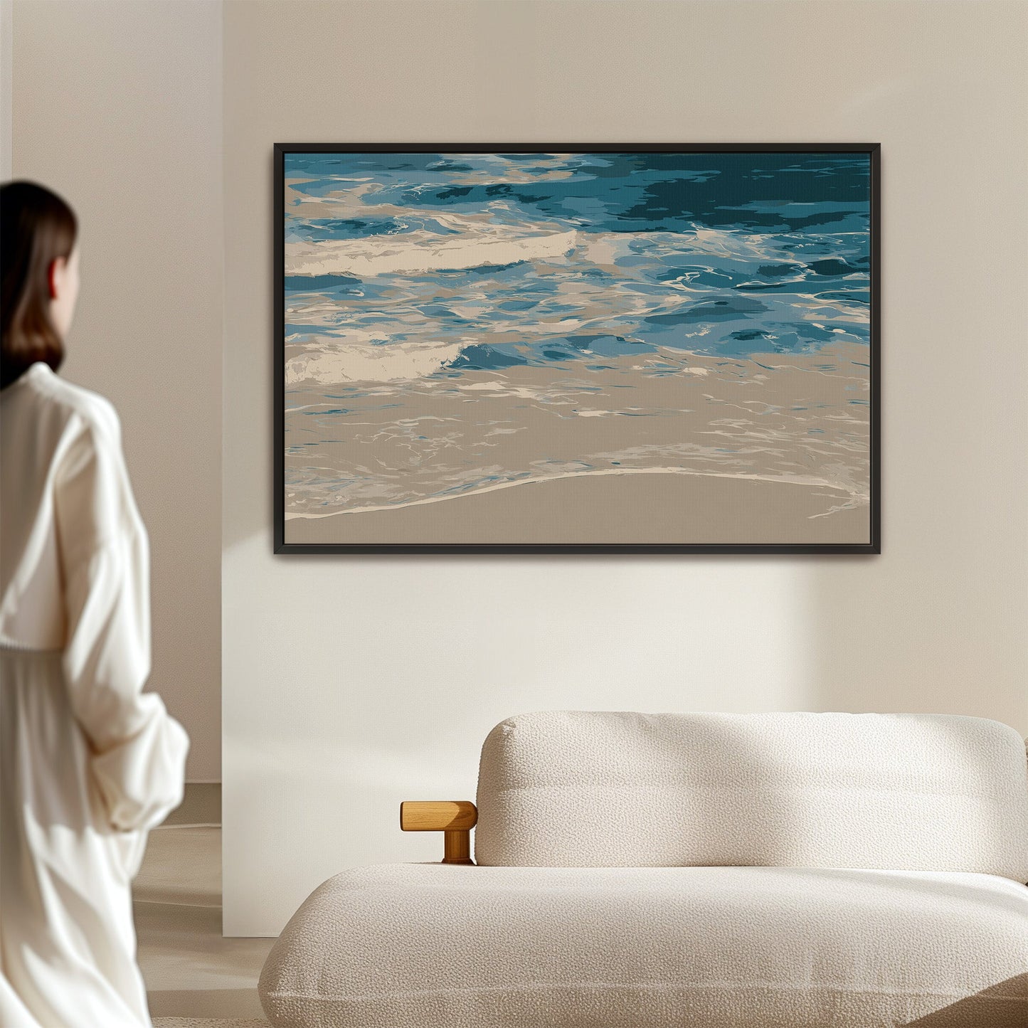 Marin canvas print depicting abstract shoreline with blues and neutrals in minimalist frame above modern sofa