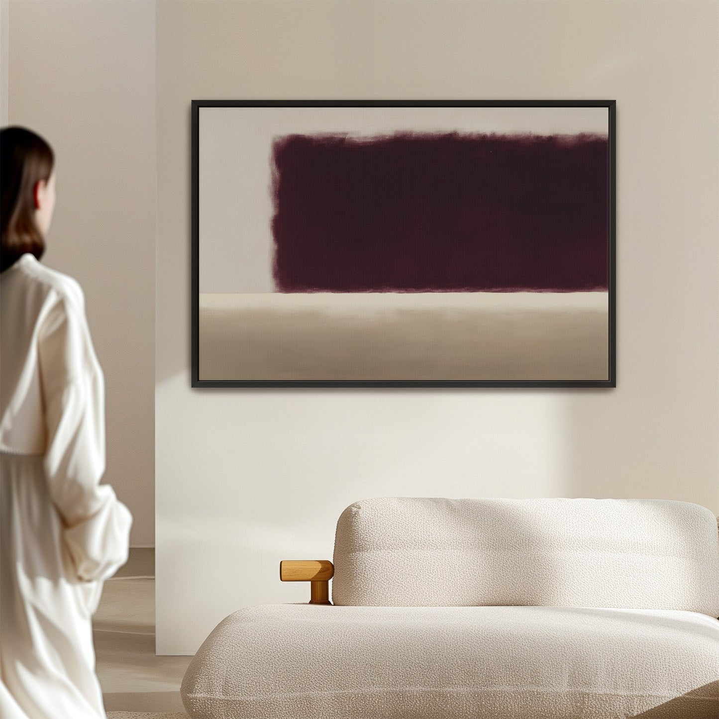 Threshold canvas wall art with deep burgundy and soft ivory abstract design in black frame above beige sofa in minimalist room