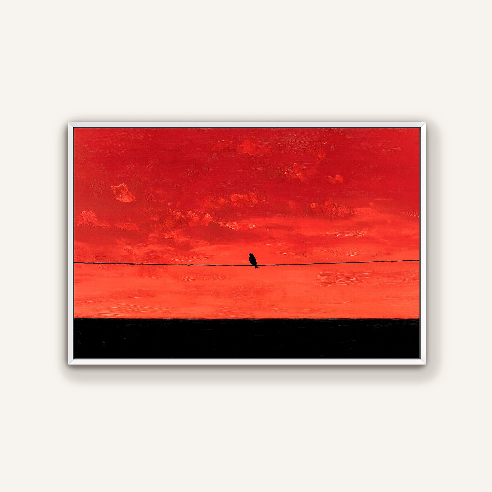 A lone bird perched on a wire against a vibrant red sky.