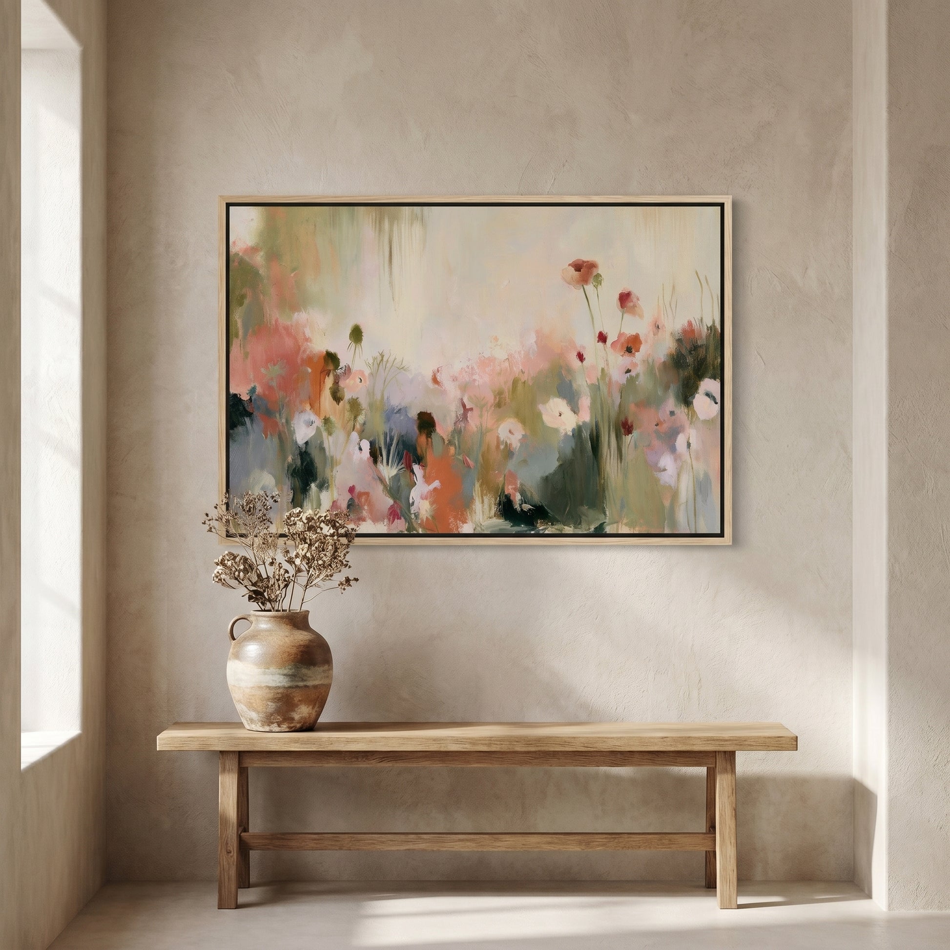 a large, colorful painting of flowers hanging on a wall above a wooden bench. The painting is framed and appears to be a vibrant display of nature.