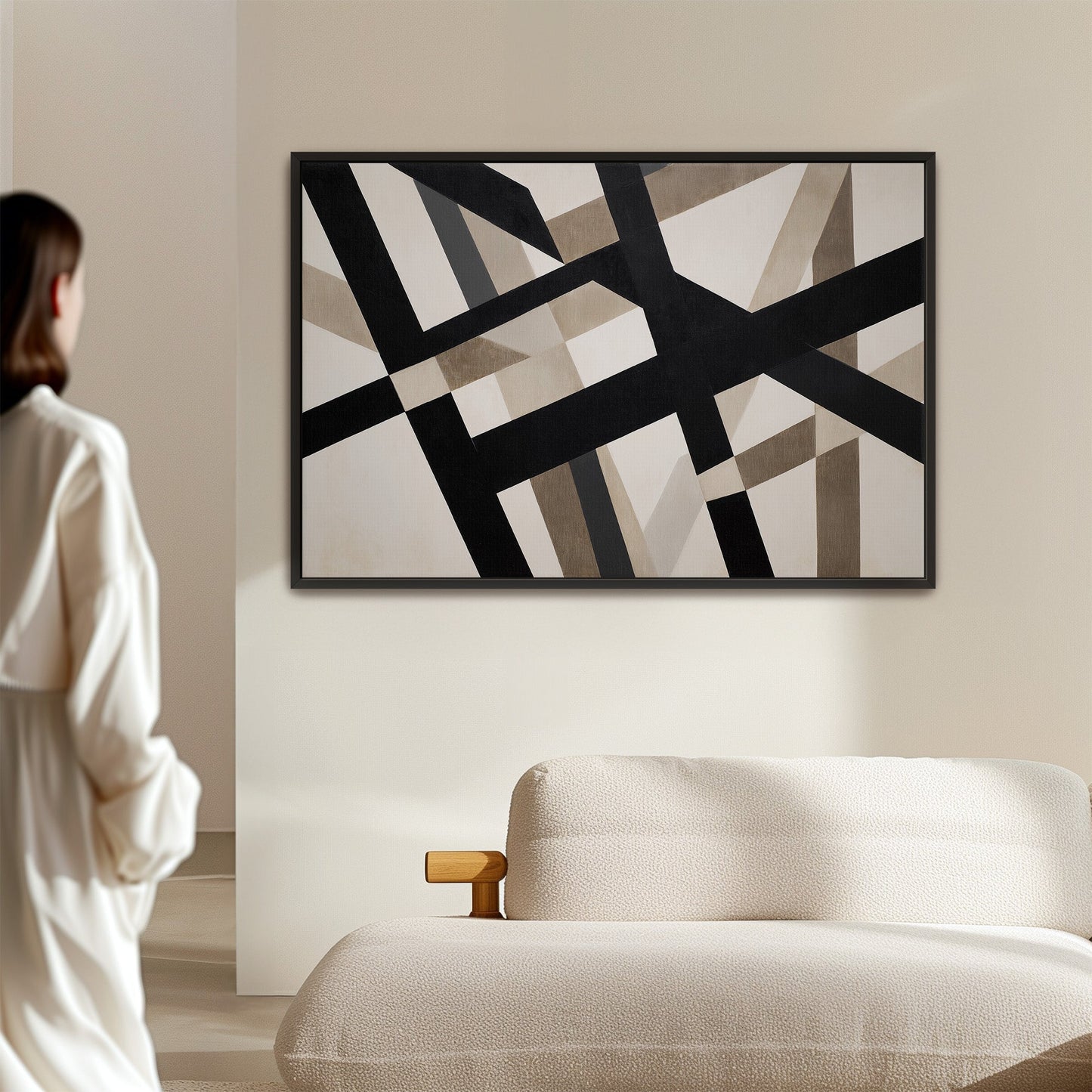 Axis canvas print with bold geometric black and neutral intersecting lines in a minimalist living room setting